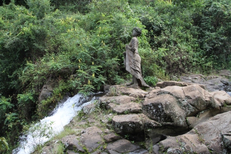 Statue at the Top of the Waterfall